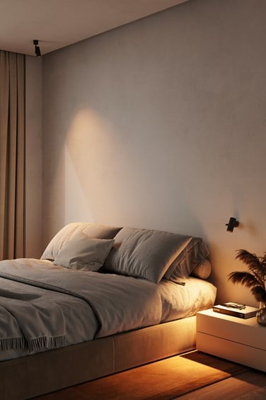 Adjustable wall and ceiling lighting in bedroom
