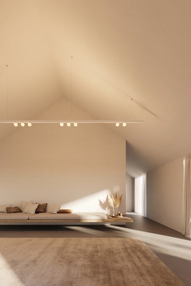 Modern white track lighting in a modern loft space combined with spherical lights