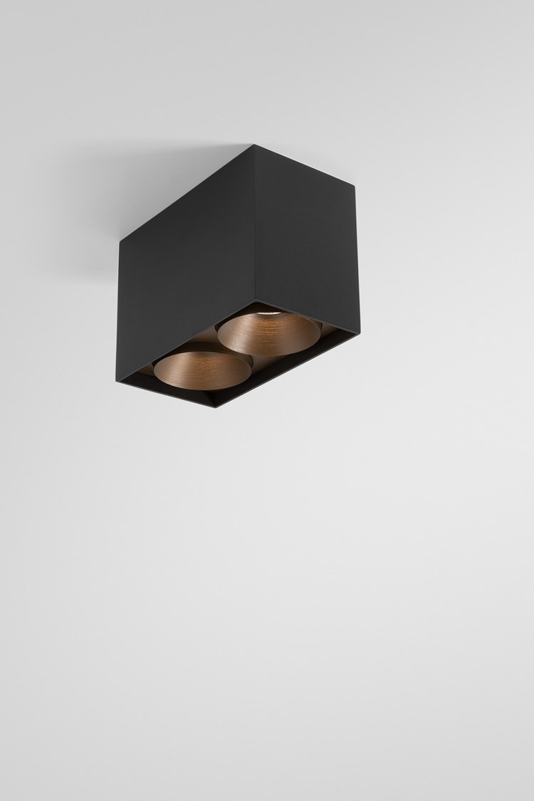 A black surface lighting box combined with bronze brushed spotlights