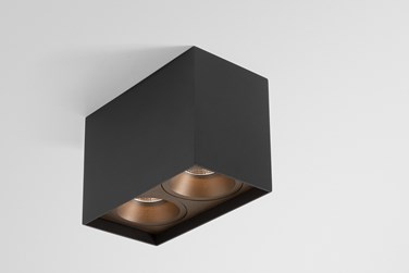 Black box with bronze spotlight