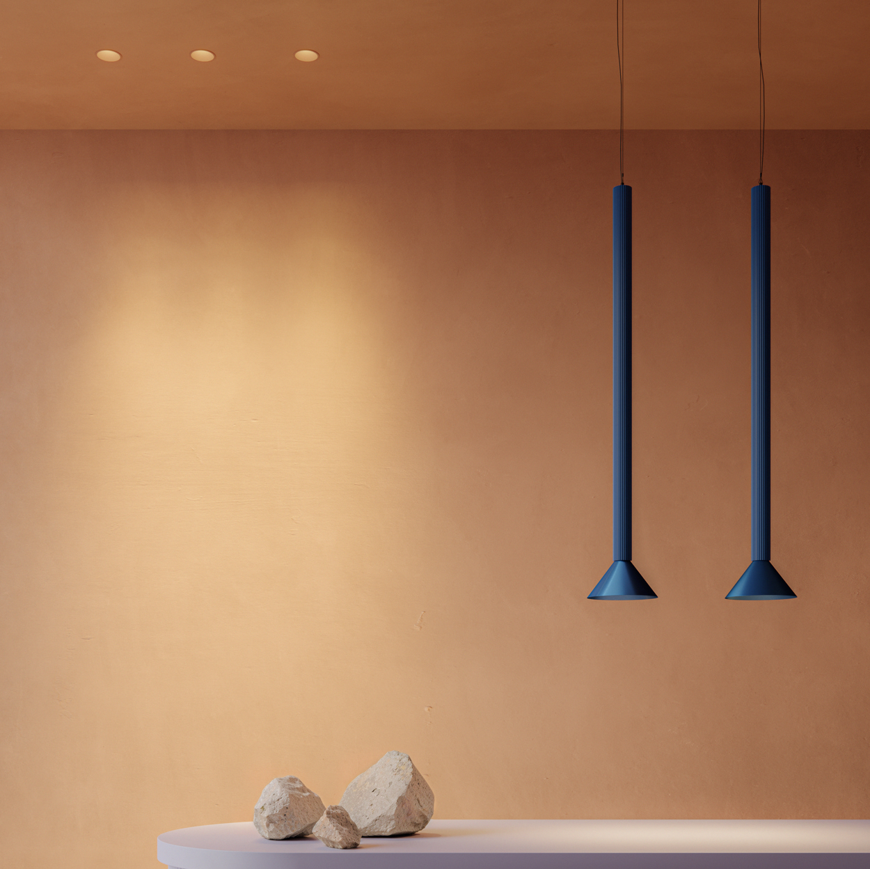 Colourful downlighters and pendants above counter top
