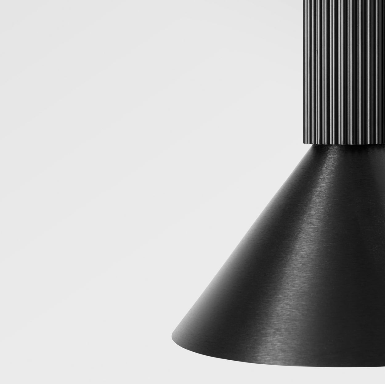 extruded pendant luminaire, ribbed tube and cone in black brushed anodised 