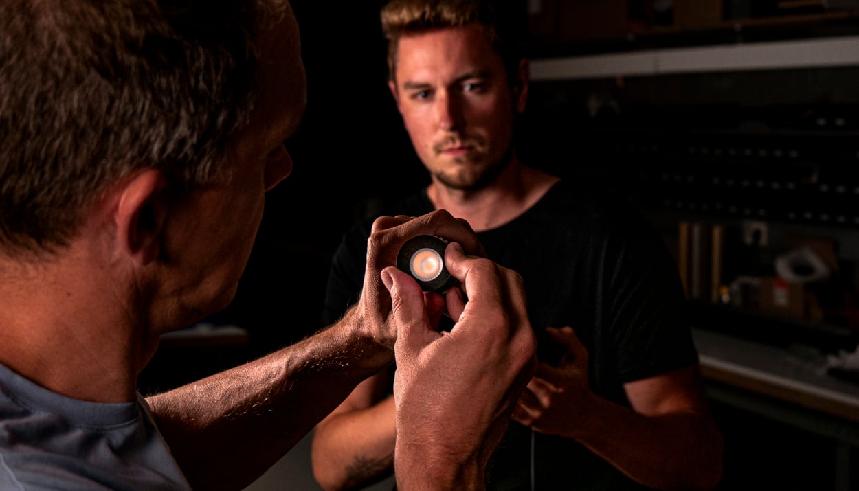engineers working on extruded stripped pendant luminaire