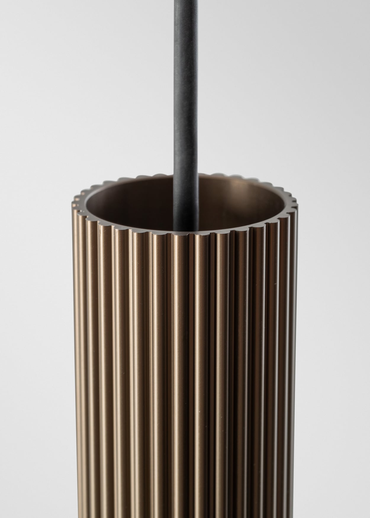 extruded stripped pendant luminaire ribbed in bronze brushed anodised