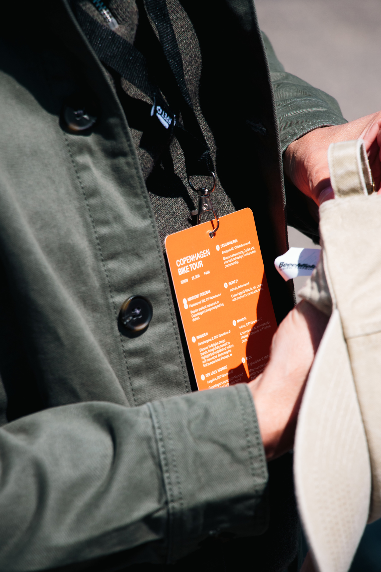 Bike tour with orange card that shows the program