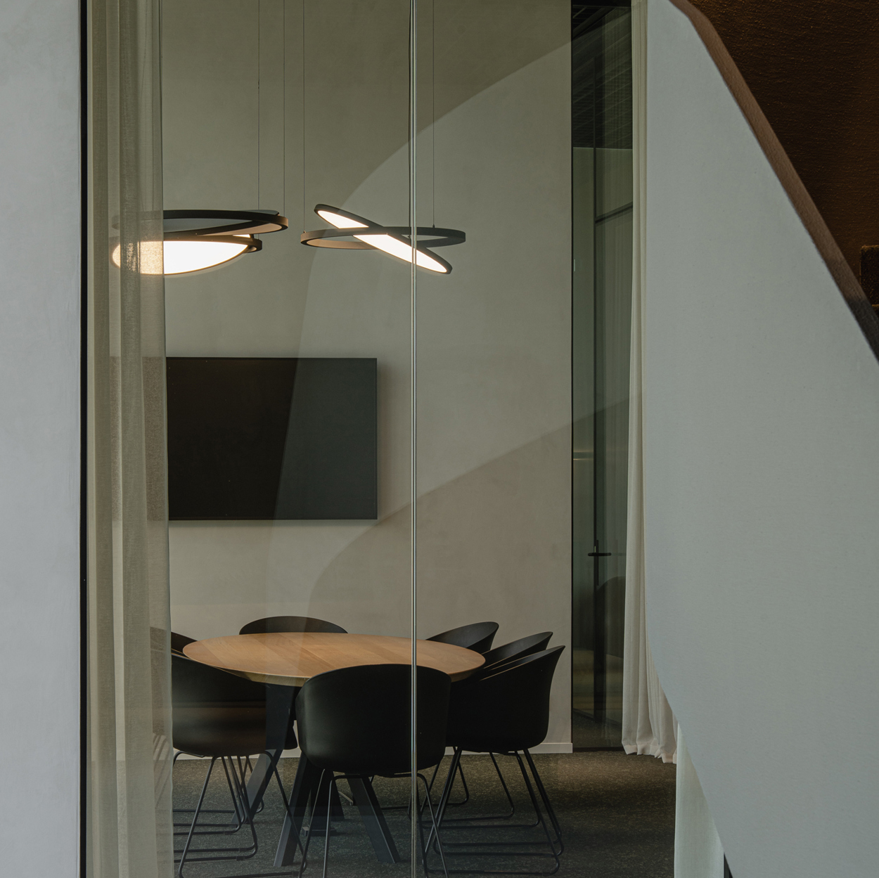 Geometry Suspended in Black Chrome in meeting room