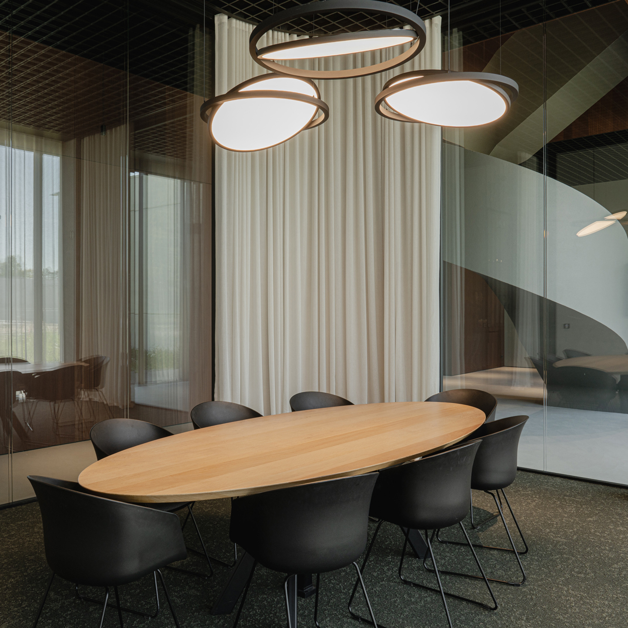 Geometry Suspended above meeting table in office setting