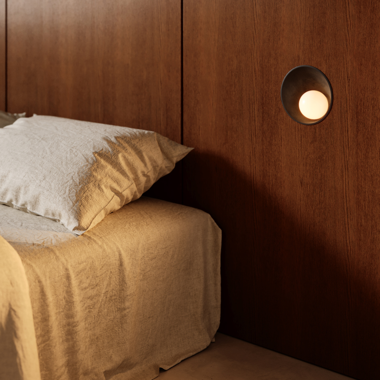 Recessed wall luminaire in bedroom